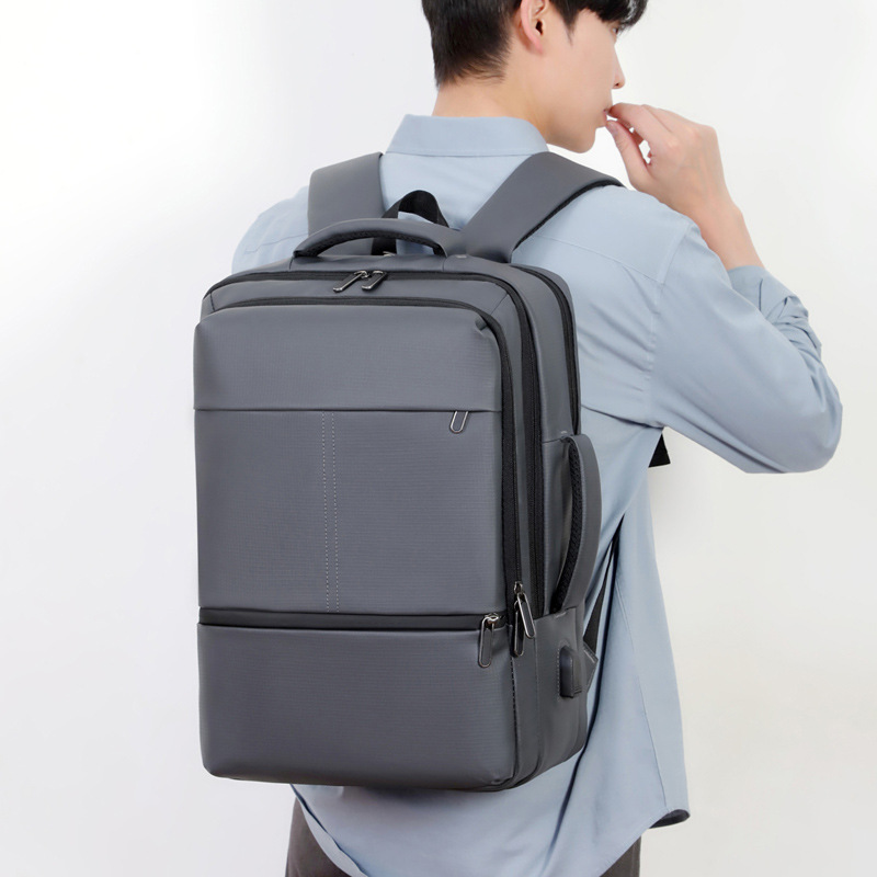 Nueva película de cuero a prueba de rociamientos mochila de gran capacidad de viaje de negocios colgante barra de tracción de embarque bolsa de computadora interfaz USB bolsa de viaje