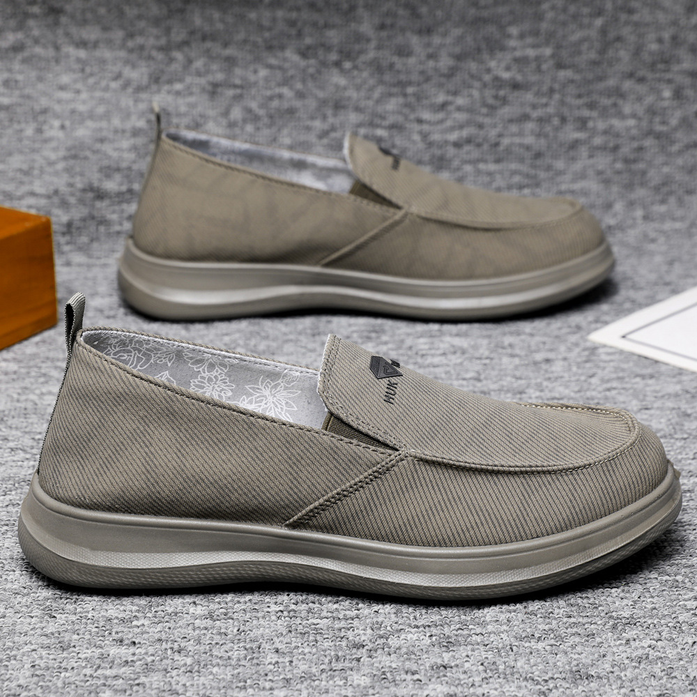 Zapatos de hombre primavera nuevos zapatos casuales cómodos de un pie zapatos de lona transpirables de suela suave zapatos de papá al por mayor