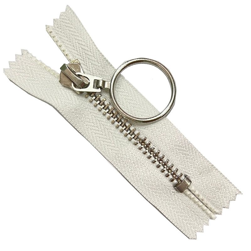 Metal platinum trousers with zipper, sweater, golden bag