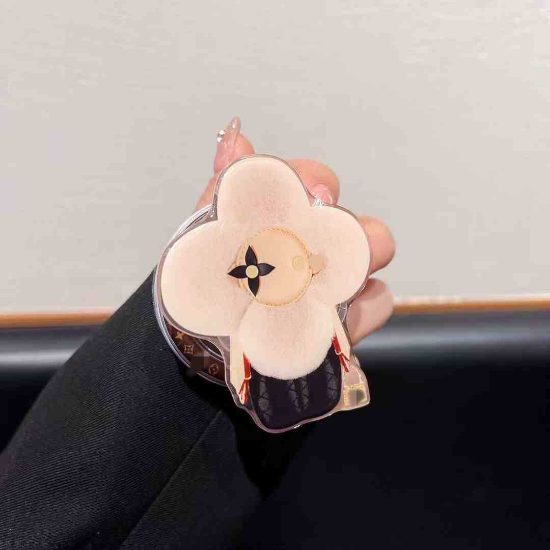 新型高級マグネットスタンドマグネット式携帯ケース通用太陽花マグネット式エアバッグスタンドはおしゃれで豪華です。