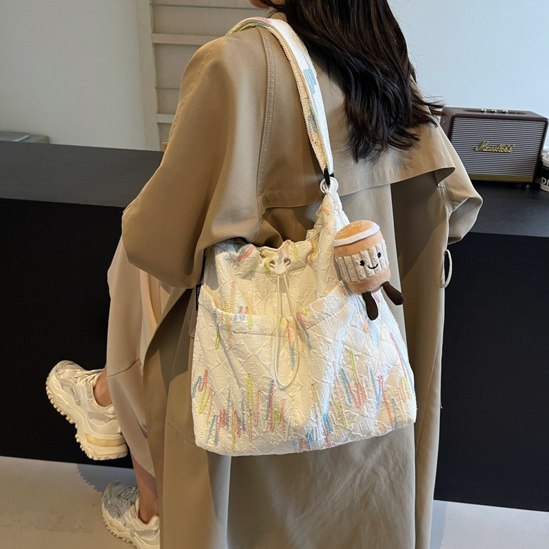 Estilo occidental todo-fósforo bolso de ocio bolso de mensajero mujer 2025 nuevo bolso de cubo de moda simple bolso de lona de viaje para estudiantes