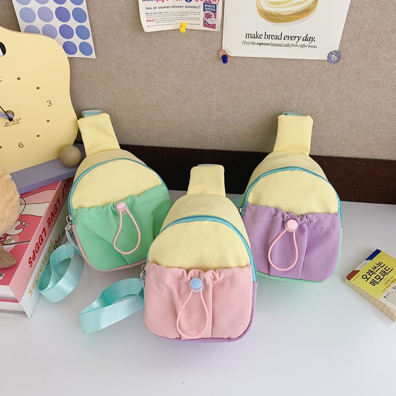 Moda coreana para niños y niñas bolsas de pecho de color contrastante, mini bolsas de bebé 2026 nuevas bolsas para niños