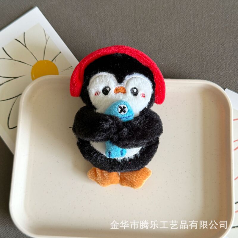 騰楽キーキーはアニメの可愛い頭カバーのペンギンのカバンのペンダントのキーホルダーの人形の飾りと言います。|undefined