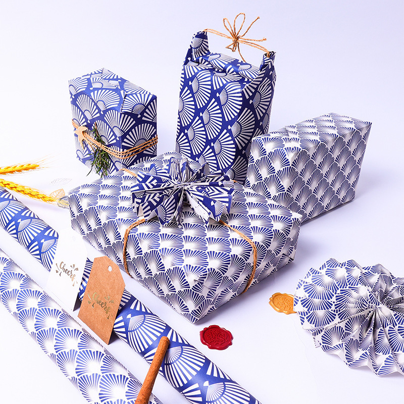 Nuevo ventilador estilo nacional papel de regalo de dibujos animados patrón azul DIY regalo papel de regalo al por mayor