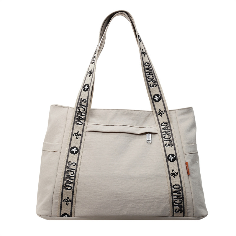 Bolso Tote portátil horizontal de tela de nailon para mujer 2025 nueva moda casual todo fósforo bolso de hombro de trabajo