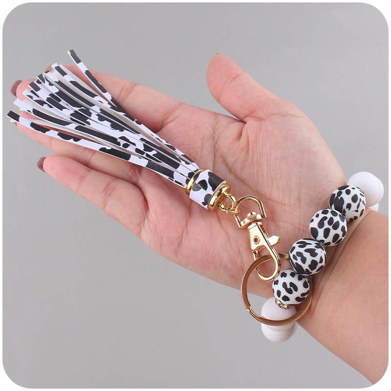 Nuevo cuero pu borla colgante creativo DIY nombre silicona con cuentas leopardo contraste color colgante pulsera llavero