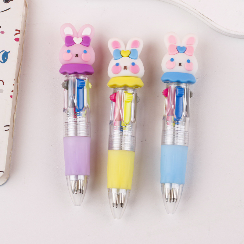 Fabricante mayorista de cuatro colores bolígrafo de silicona bolígrafo multicolor de dibujos animados cabeza portátil de estudiantes