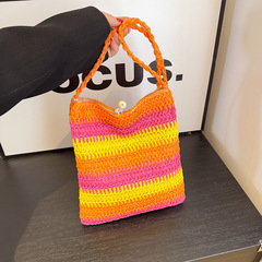撞色時尚簡約草編包單肩水桶包包2024新款復古編織沙灘旅遊斜挎包
