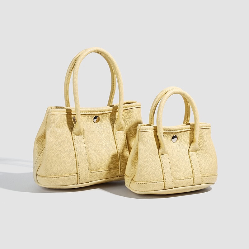 2025 Autumn New Niche Simple Casual Commuting Handheld Bucket Bag Korean Style Design Solid Color Crossbody Bag for Women 2025 Autumn New Niche Simple Casual Commuting Handheld Bucket Bag Korean Style Design Solid Color Crossbody Bag for Women