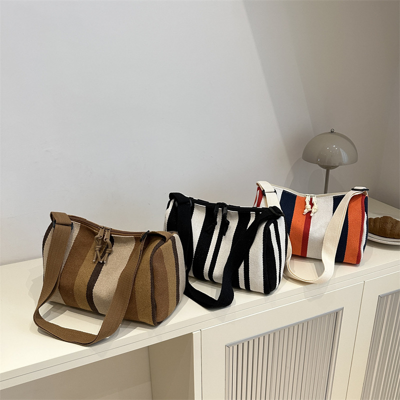 Bolsa de hombro coreana de gran capacidad para mujeres 2024 nuevo estilo simple a rayas verticales mochila casual bolso de almohada de moda