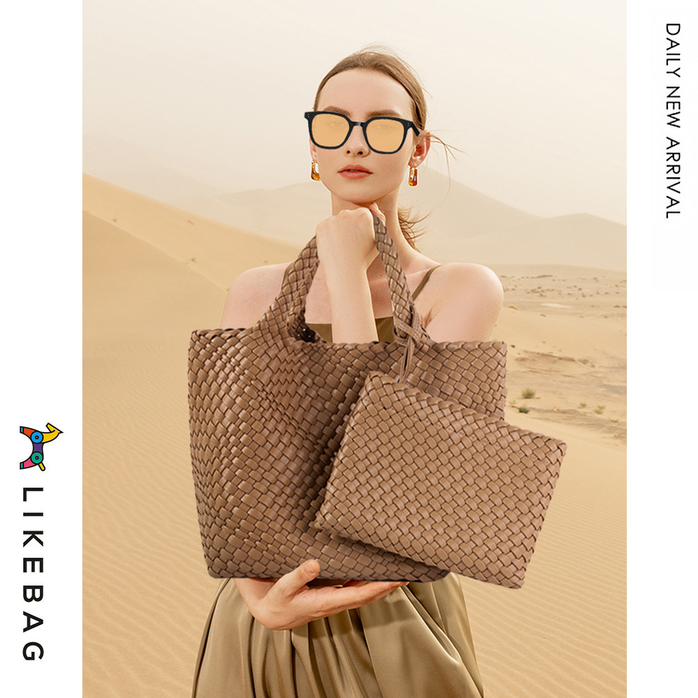 Bolso de mano de viajero de negocios transfronterizo bolso de mano de gran capacidad tejido PU 2022 nueva moda casual tejida Madre y niño bolsa