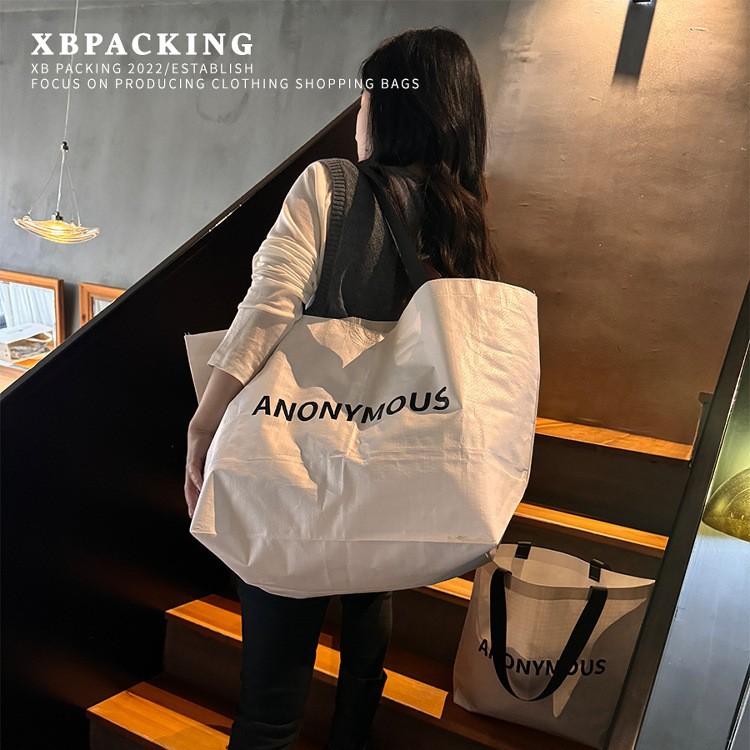 Tienda de ropa de bolsas tejidas bolsas de mano personalizadas impresas logo red Wind bolsas tejidas de alta capacidad bolsas tejidas bolsas de ropa