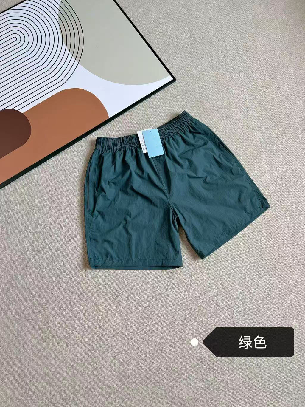 2025 verano nuevo co-marcado para hombres y mujeres transfronterizos pantalones cortos deportivos de tejido 8194