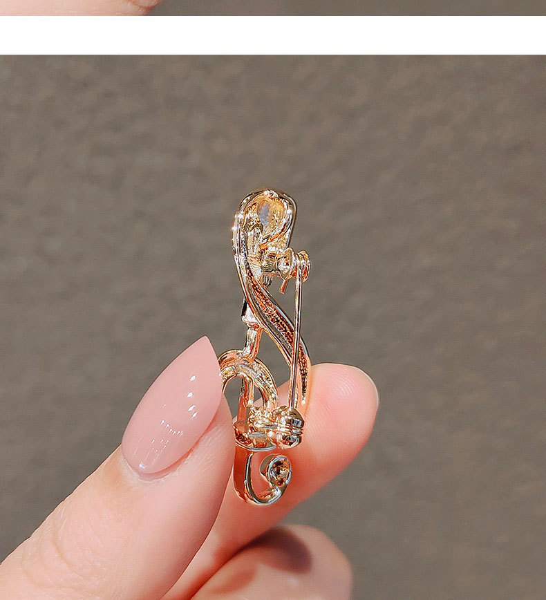 Spilla a forma di note musicali e microfono per donna, elegante_voghion.com