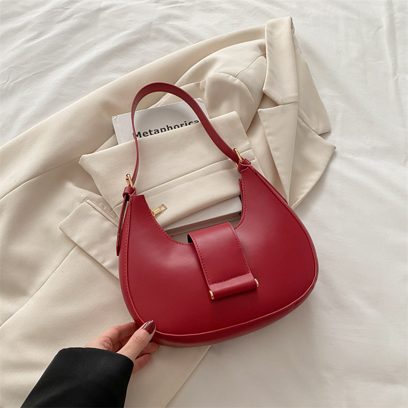 Bolso popular de este año para mujeres 2025, nueva moda de un solo hombro, bolso de diseño de nicho, bolso de media luna debajo de la axila