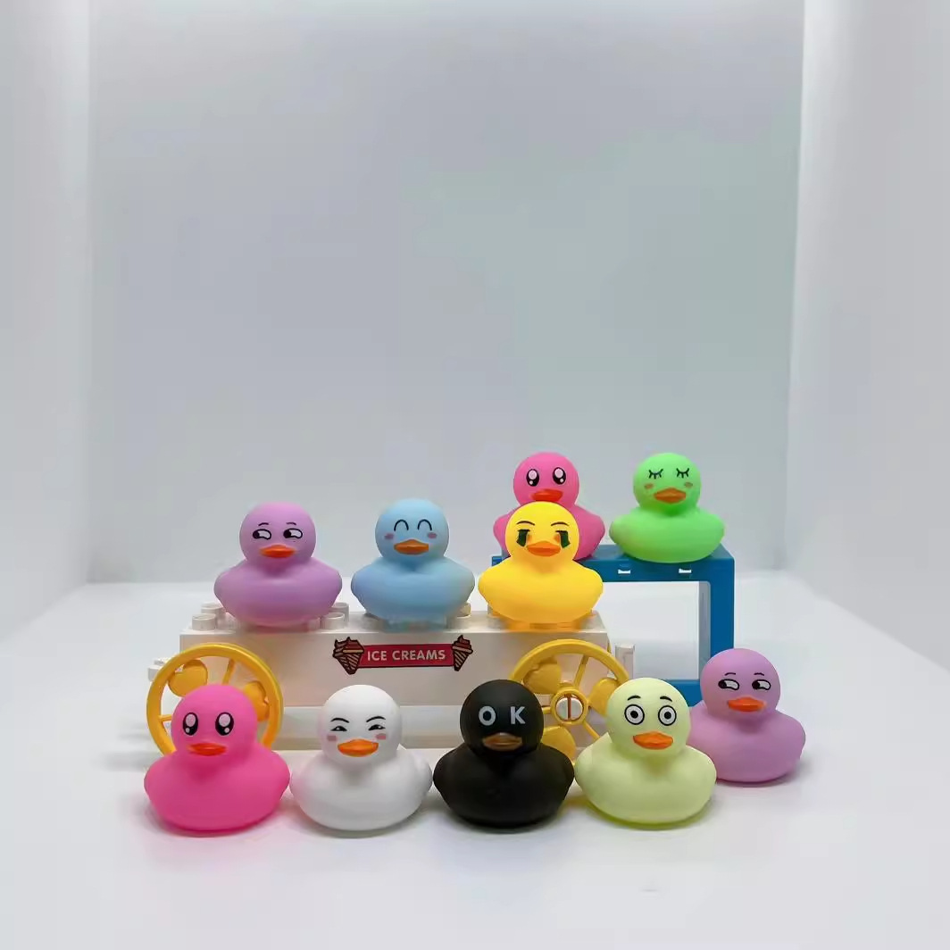 Cute little yellow duck pinch called Internet celebrity facial expression duck water toy bath artifact BB ring cute animal gift