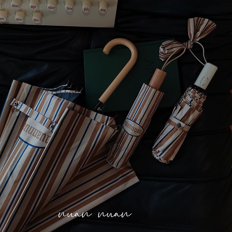 アメリカンレトロストライプ高颜値雨伞レディース折り畳み晴雨両用日焼け止め紫外线耐风日伞インスタ