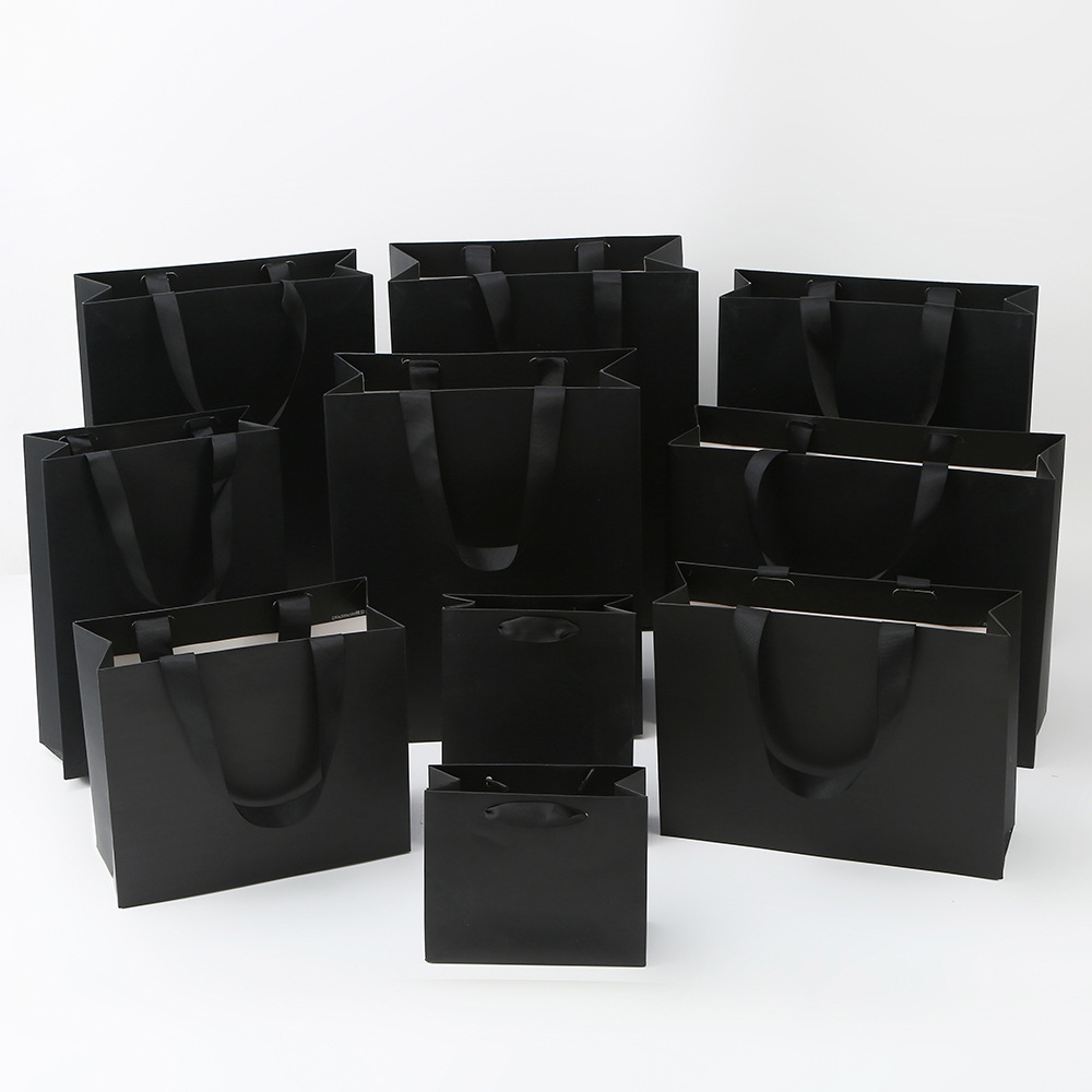 Bolsa de cartón blanco logotipo tienda de ropa bolsa de mano bolsa de regalo espesa bolsa de regalo de Navidad se puede imprimir