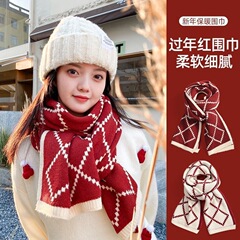 新年のクリスマスに赤いニットの純色のマフラーを厚くします。