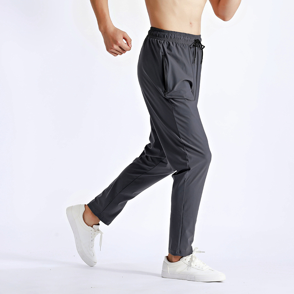 Pantalones deportivos de hombre para correr Fitness rápido secado respirado con cremallera bolsillo suelto gran tamaño de nylon hielo pantalones de cintura alta