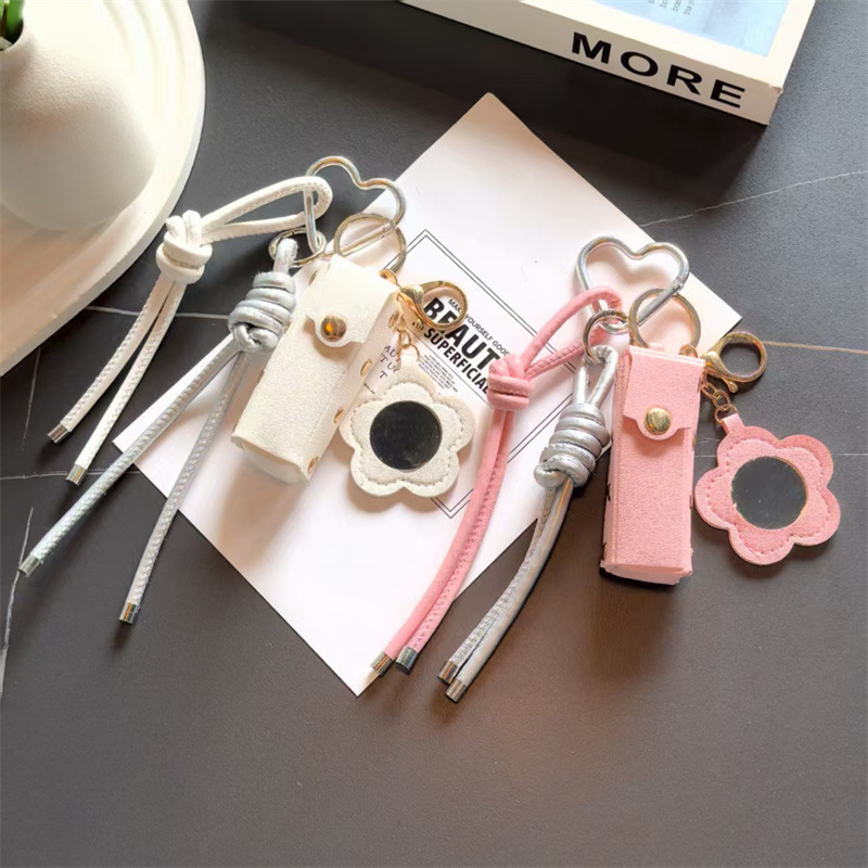 Espejo de cuero transfronterizo lápiz labial bolsas de llaves creativas flores portátiles maquillaje espejo bolsas colgantes accesorios de llaves PU