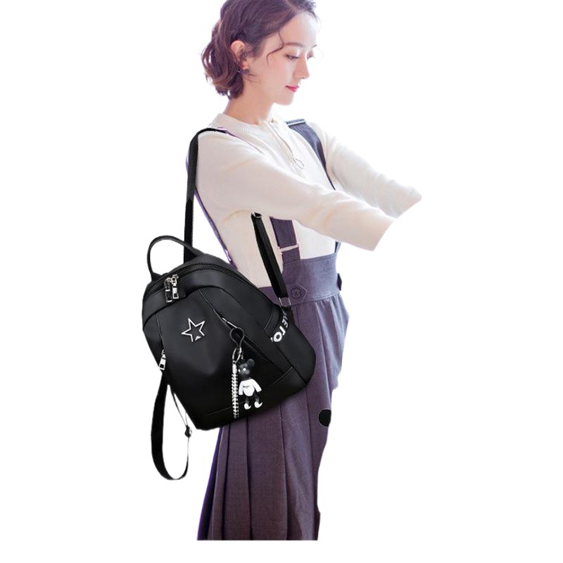 Fábrica al por mayor Mochila de tela de nylon de gran capacidad de ocio de las mujeres mochila estudiante de secundaria mochila bolsa de viaje al aire libre