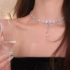 Pendant with bow with zircon