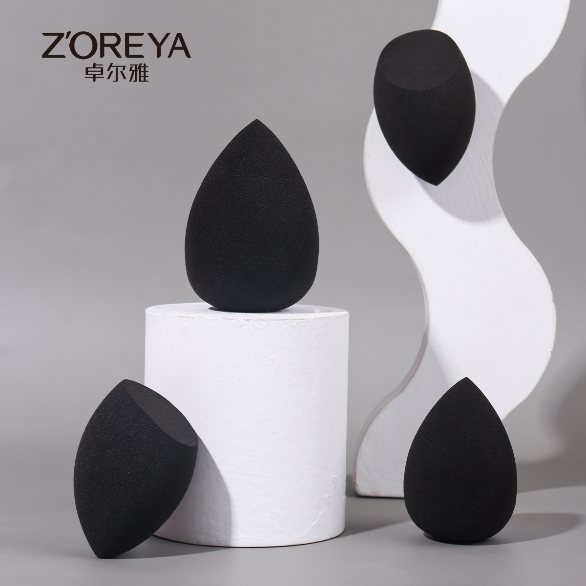 Fábrica directa huevo de maquillaje caja de polvo de gota de agua polvo huevo de maquillaje negro huevo de maquillaje biselado esponja polvo de polvo