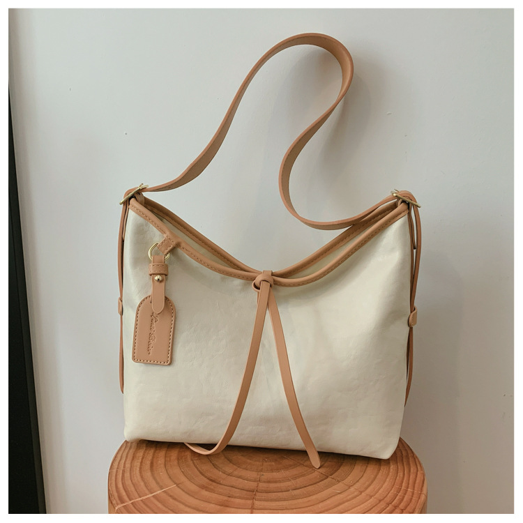 Bolso de brazo retro de gran capacidad para mujeres 2026 nuevo nicho de lujo ligero de hombro mochila de viaje ligero de lujo bolso de mano