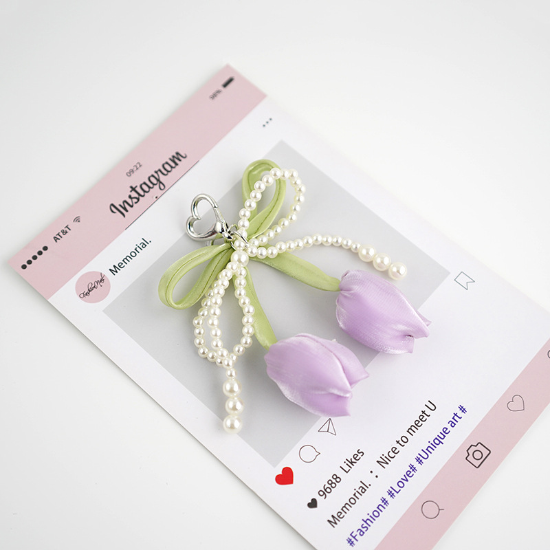 Venta caliente todo fósforo tulipán perla rosa serpentina arco púrpura colgante amor llavero bolso colgante