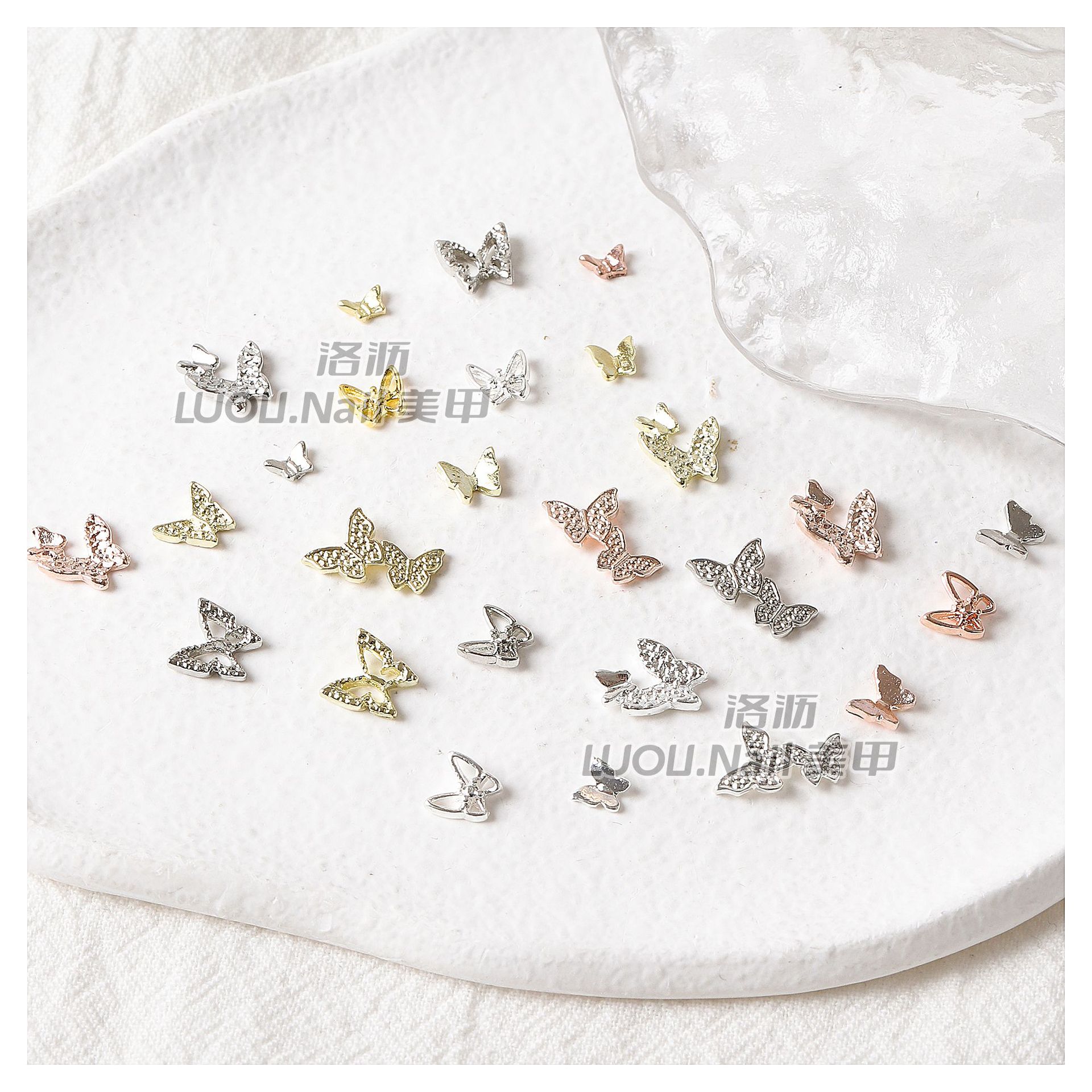 Nueva mariposa japonesa joyería de uñas en línea celebridad aleación tridimensional mariposa de una pieza mini mariposa hueca decoración de uñas