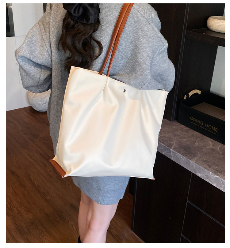 Borsa a tracolla casual da donna in tessuto Oxford, capiente, elegante e versatile, ideale per gli spostamenti quotidiani._voghion.com