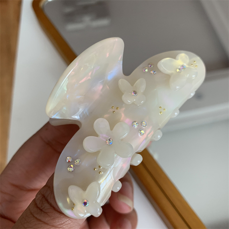 Estilo coreano Mori mariposa agarre pétalo cabeza de espalda boca de tiburón agarre del pelo industria pesada nicho diamante incrustado placa azul claro agarre del pelo