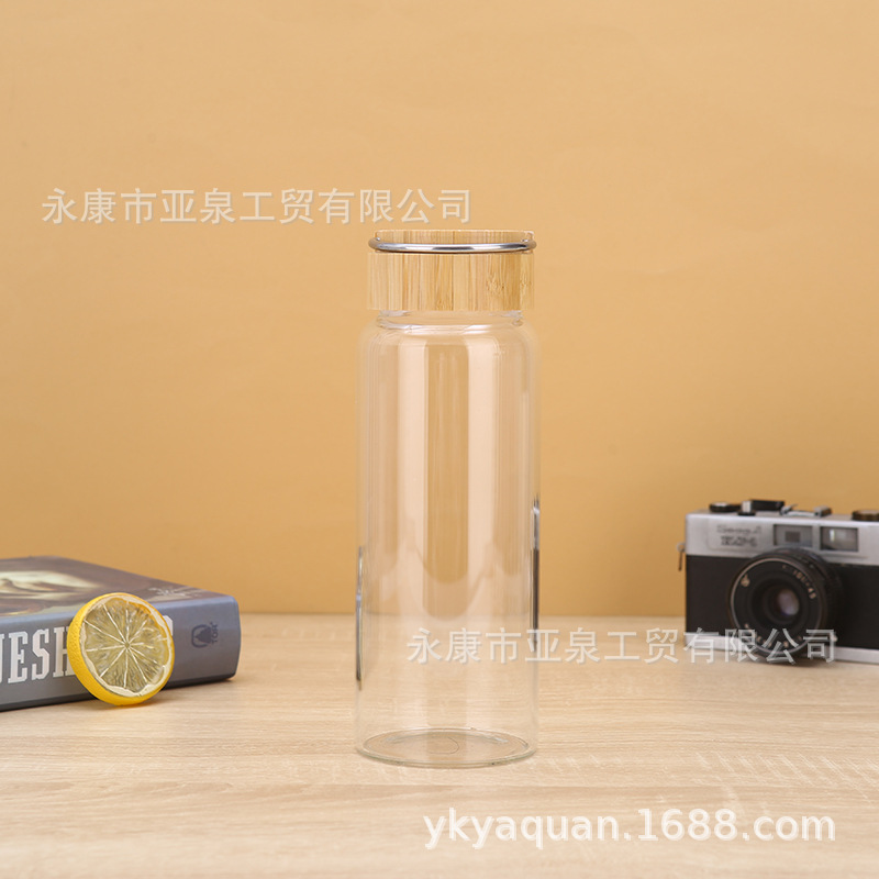 Fabricantes de suministro de copas de bambú portátiles de vidrio transparente aislamiento térmico taza de agua de oficina acompañante taza de regalo se puede imprimir logotipo