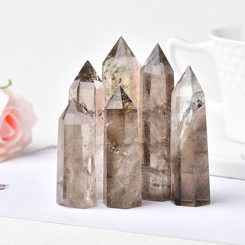 Cross-border hot-selling natural tea crystal column single-pointed hexagonal prism raw stone polished smoky crystal column home office Feng Shui ornaments