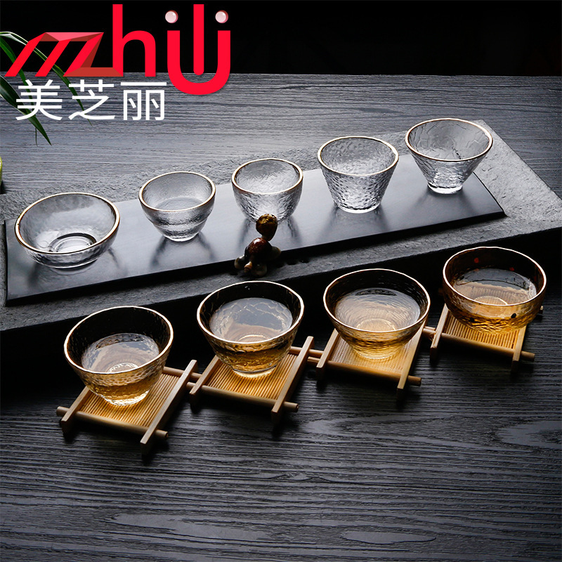 Patrón de martillo Xingran vidrio resistente al calor Taza de té de tres patas de oro juego de té de Kung Fu Propietario de una sola taza patrón de martillo de borde dorado taza de té pequeña