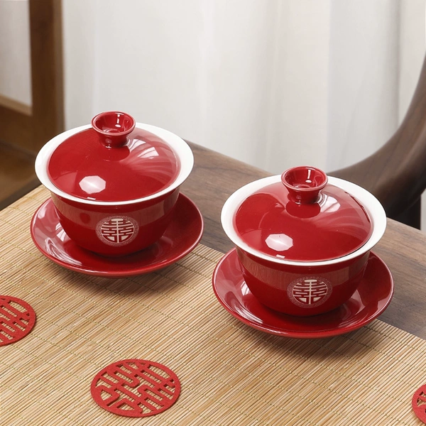 A pair of red teacups