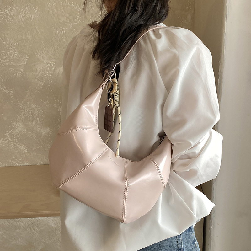 Transfronterizos coreanos perezosos bolsas de brazo de cera nicho bolsas de cuerno de piel de cera 2026 nuevas bolsas de brazo diarias mujeres