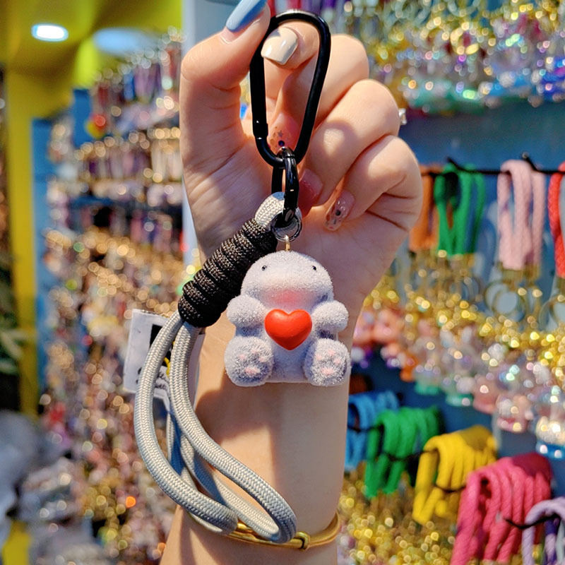 Nuevo caricatura flocado amor Godzilla llavero de moda pareja llavero bolsos de mujer accesorios colgantes de teléfono móvil joyas