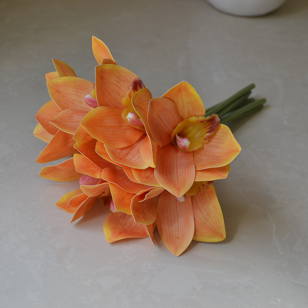 cymbidiums with bunches and flowers in hand, home model room decoration, dining table and coffee table decorations, fake flowers_voghion.com