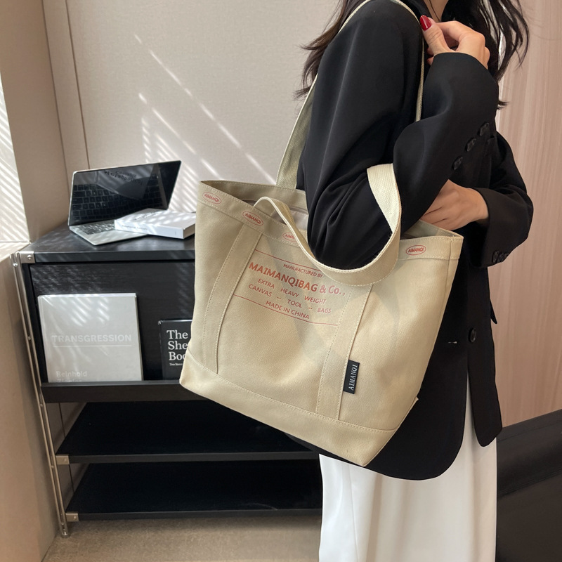 간단한 패션 단색 토트 백 여성의 대용량 숄더백 통근 가방 새로운 가방 올 매치 캔버스 가방