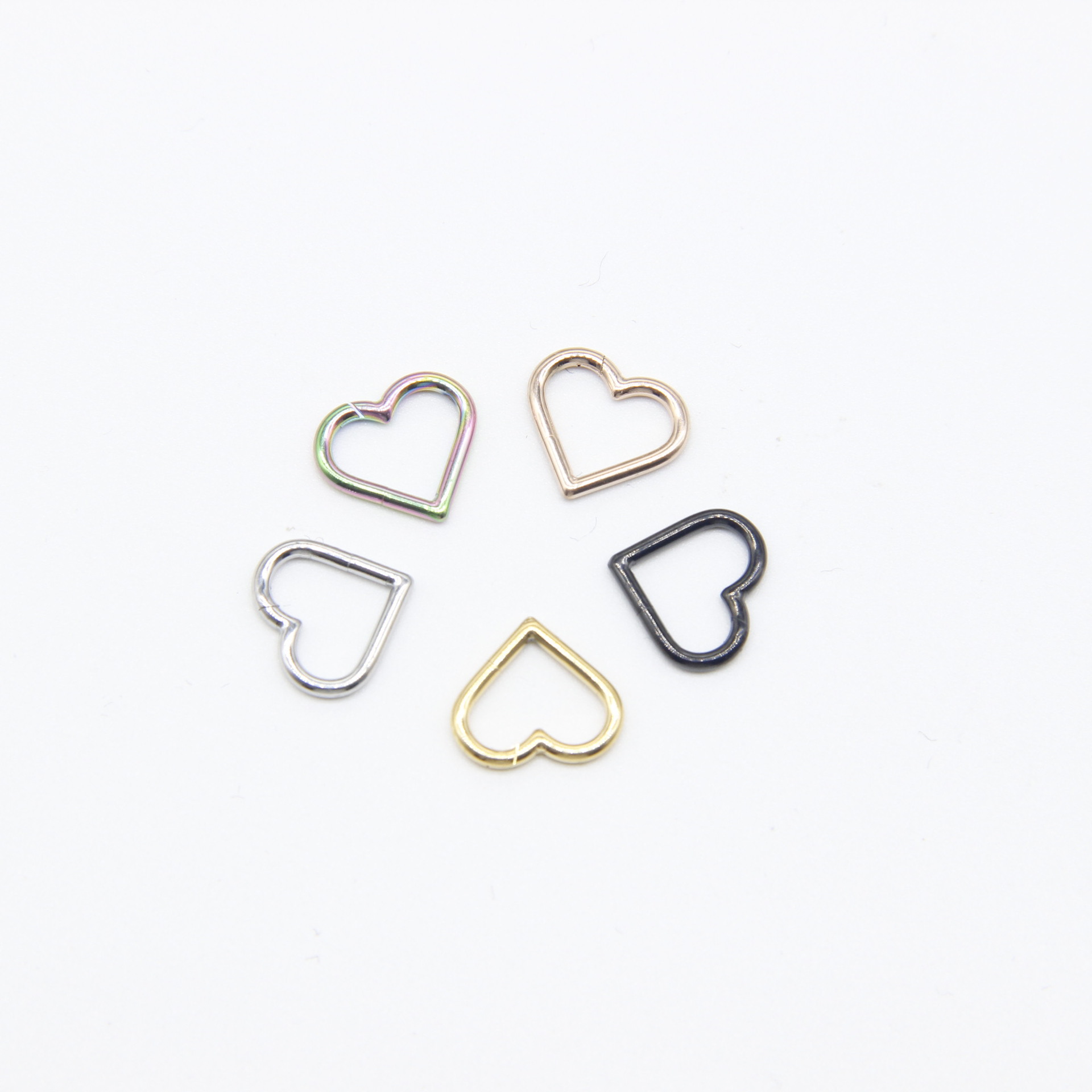 Spot sales of European and American e-commerce Personalized puncture heart-shaped perforated nose ring breast ring nose nail 316L stainless steel earrings