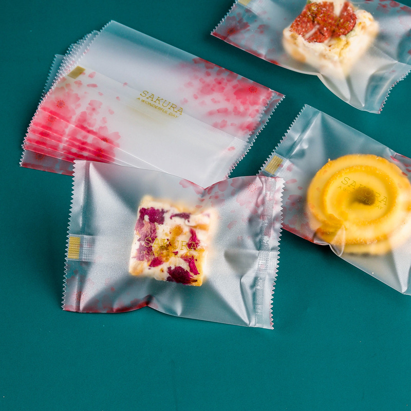 双面14丝加厚磨砂花朵零食包装袋粉色花瓣雪花酥曲奇牛轧饼机封袋