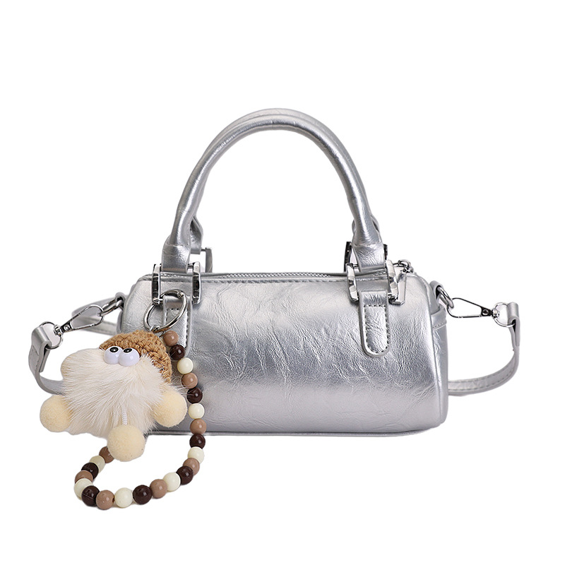 Nicho de diseño retro bolso de mano mujer 2026 primavera nuevo bolso de hombro sensación diaria de moda oblicuo bolso cilíndrico