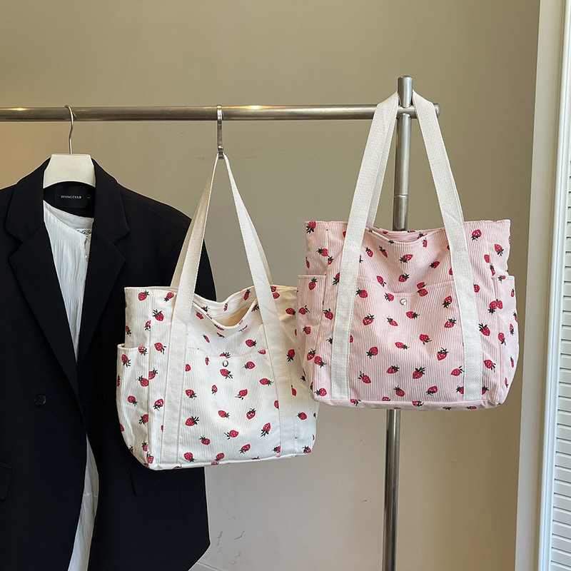 2025 verano nuevo bolso de mano de gran capacidad simple estilo universitario de moda ocio de tela de meandarra bolso de hombro