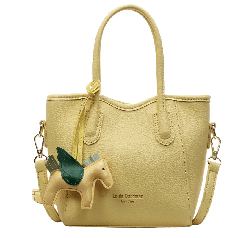 Bolsa de cubo portátil de estilo occidental de alta calidad para mujer 2025 nuevo bolso de mensajero de hombro de viajero de estilo explosivo de moda salvaje