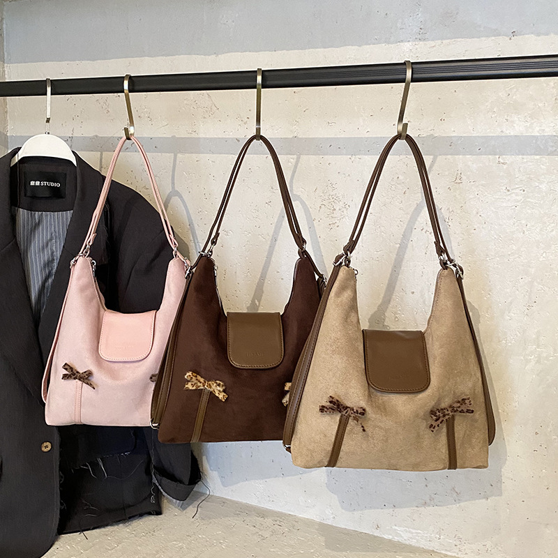 Nueva versión coreana de la mochila para niños y niñas, mochila para bebés de gran capacidad, mochila para bebés, mochila para niños con arco lindo.