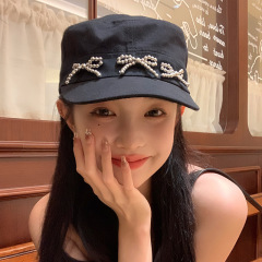 韓国の小衆の蝶結びのアヒルの舌の帽子の女性の春夏の復古の小さい香りの風の黒色の野球の帽子は顔の小さい日よけの帽子を現します。