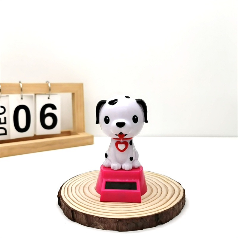 Adornos para automóviles cruzados, decoración para automóviles de resina, accesorios interiores para perros de palomitas de maíz para automóviles solares, sacudiendo la cabeza y llamando a la muñeca