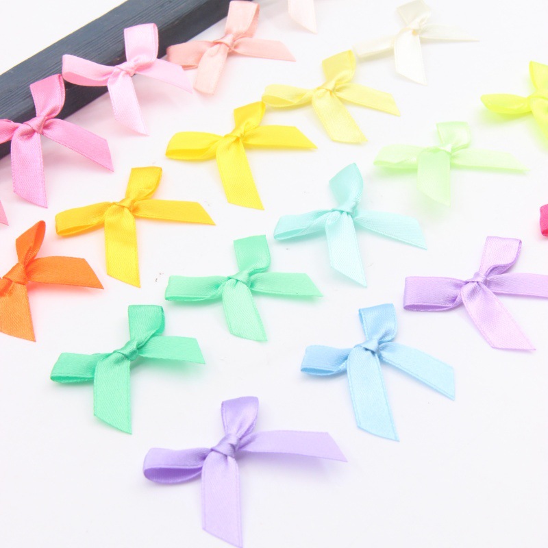 1cm arco de cinta accesorios DIY arco de mano 100 pcs / paquete de piruola arco de decoración